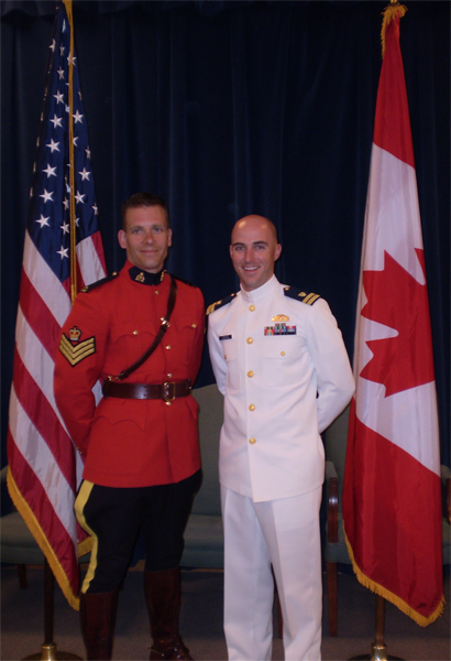 A Royal Canadian Mounted Police officer and a United States Coast Guard officer.