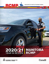 front cover photo of officer at a car window