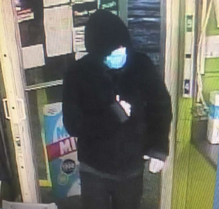 Clarenville RCMP looks to identify this individual, wearing a disposable face mask, a black hooded sweater with grey trim, white gloves and black pants, who committed an armed robbery at the Needs Convenience Store in Clarenville on August 28, 2020.