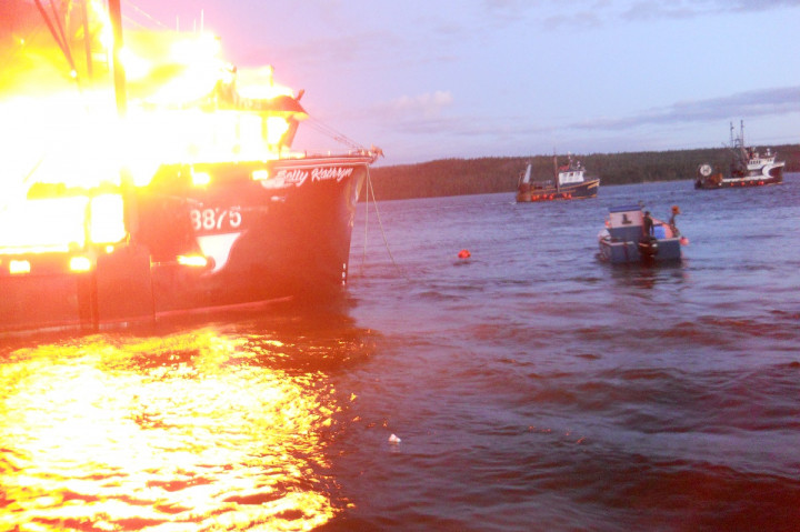 Fishing vessel Sally Kathryn was towed out into the water while on fire to reduce damage to other vessels and the government wharf at the Port Saunders Marine Service Centre on September 15, 2020.