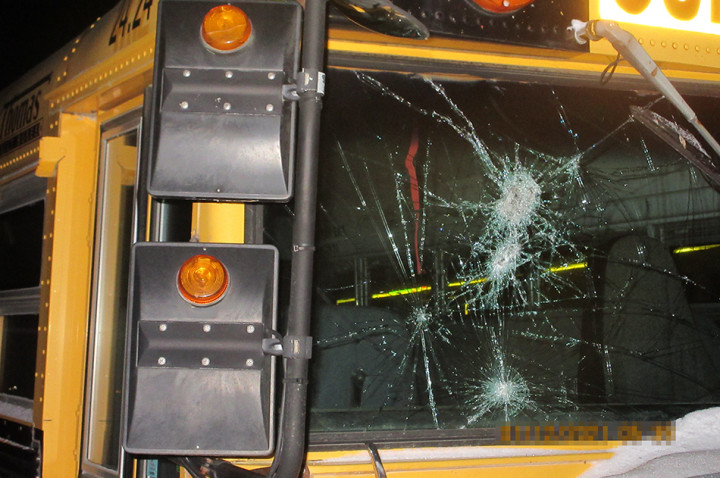 School bus with smashed window