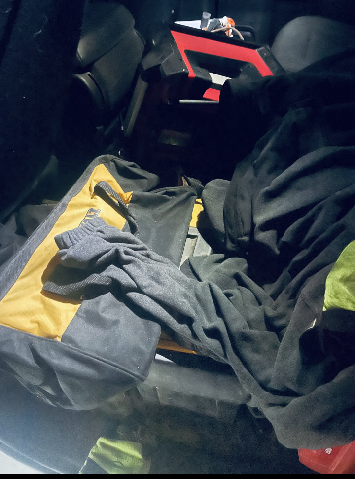 Toolbox and folded-up clothing