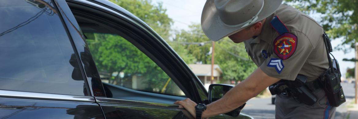 Police officer at traffic stop.