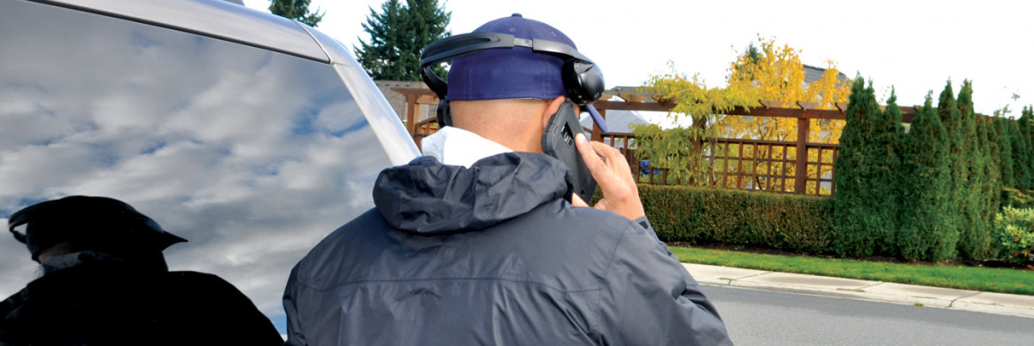 Male police officer talking on cellphone.