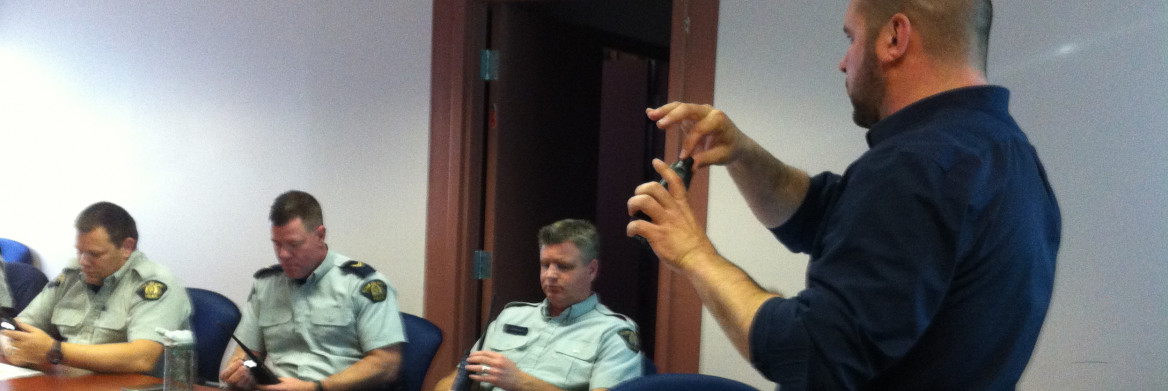 Police officer demonstrates radio equipment.